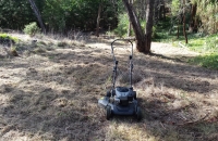 Hand Mower, Cutting over grown bush block - in accessible to ride on